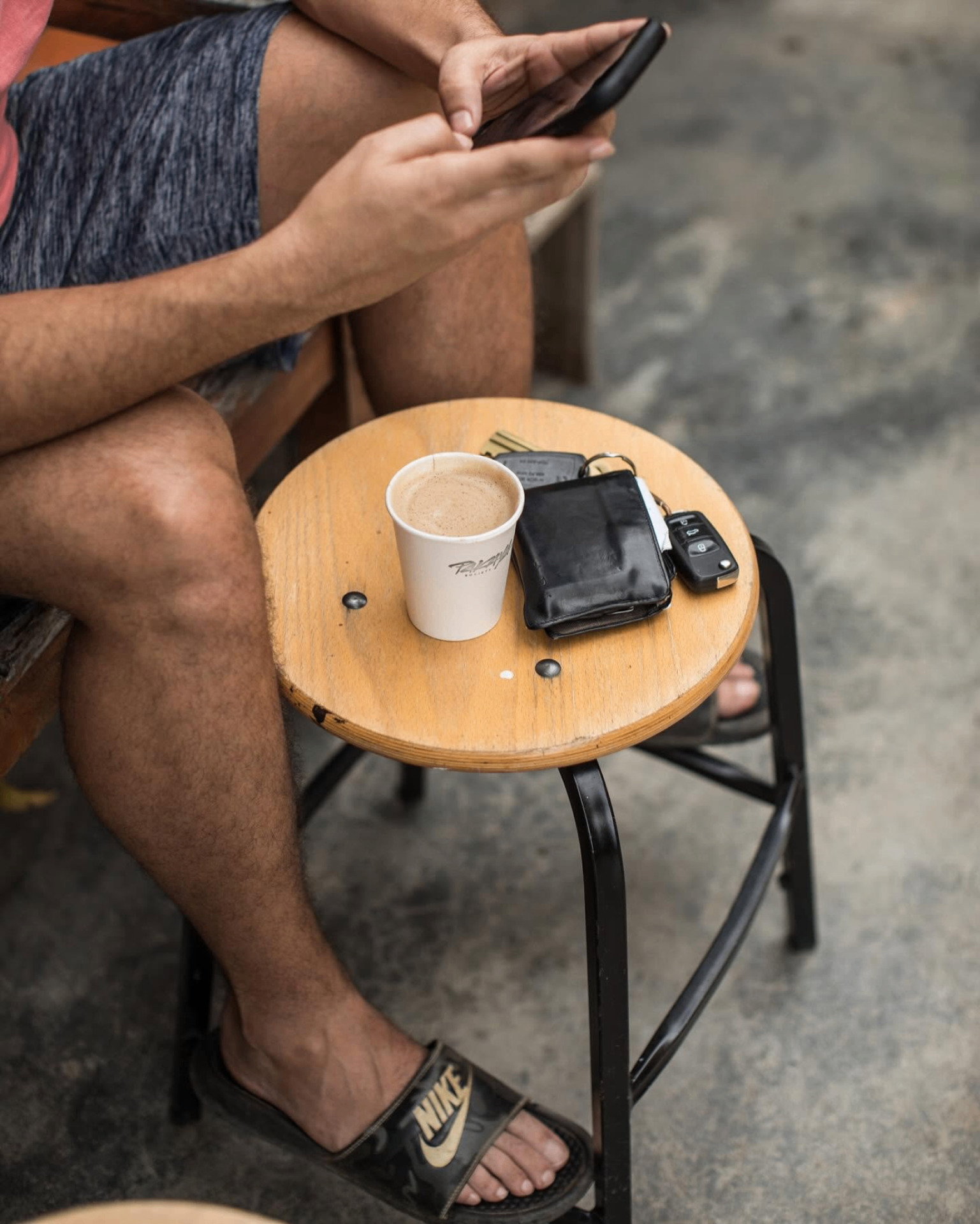 Pakaya cup, wallet, and keys on a stool